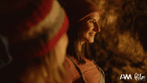 Still from Jelly film featuring two people in beanies. One person is looking forward and the other looking at the other person.