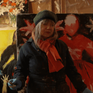 Still of Shani Rhys James standing in front of a painting
